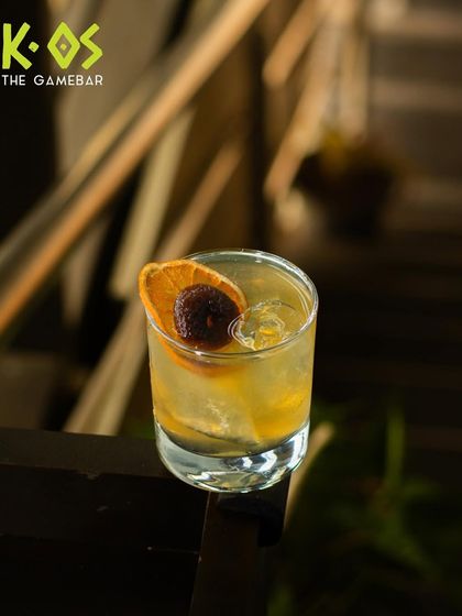 This sassy little cocktail is dressed to impress, perched on the railing and ready to be enjoyed.