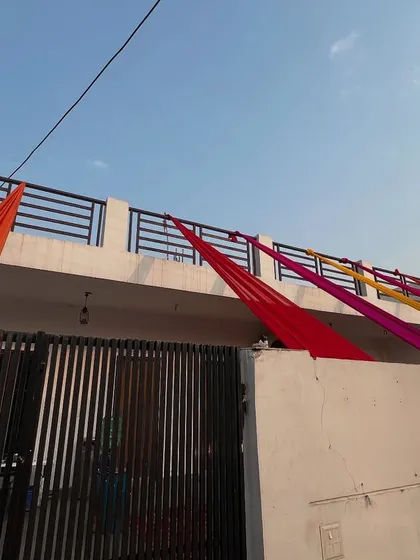 Simple decoration for a house terrace or balcony using colorful drapes.