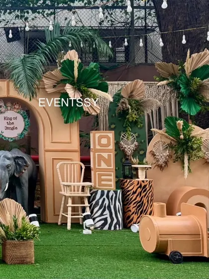 A view of the setup featuring large 'ONE' blocks and an elephant prop, perfect for a first birthday photo opportunity.