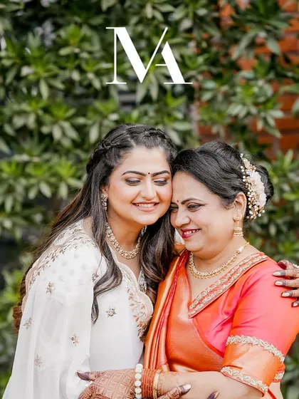 A warm embrace between mother and daughter. Their smiles and the comfort in their hug tell a story of an unbreakable bond, beautifully captured on the wedding day.