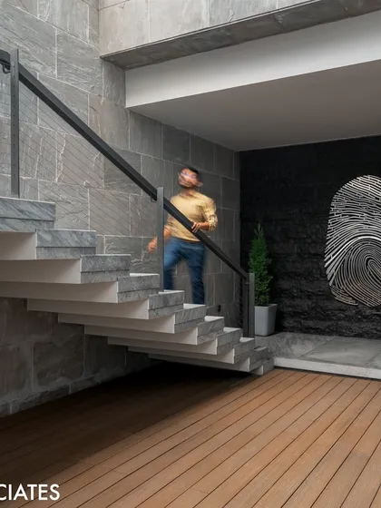 This outdoor staircase features a unique fingerprint artwork, turning a simple transition into an artistic journey and merging functionality with creative expression.