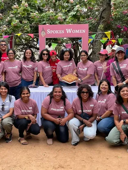 A big group photo from our Garage Sale. Our members and volunteers are seen here in our onion pink and red community T-shirts, a testament to our vibrant tribe.