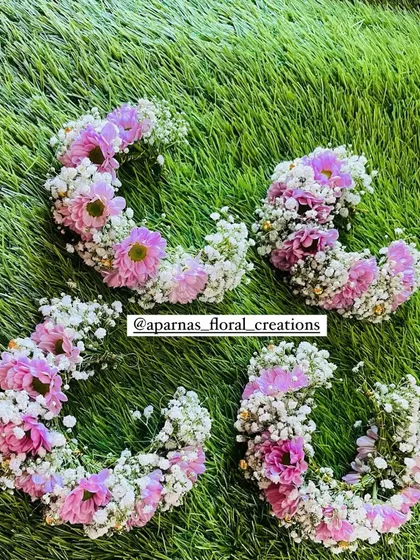 A set of four matching hair brooches or clips for bridesmaids. These are made with baby's breath and pink flowers and can be easily clipped into an updo or braid.
