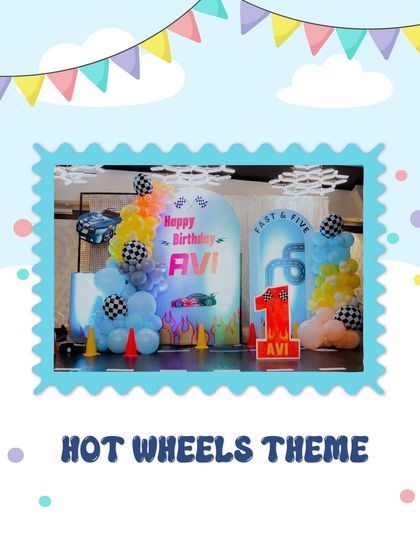 A "Fast & Five" Hot Wheels theme for a 5th birthday party. The decor includes a racetrack floor, traffic cones, and balloon arrangements in bold primary colors, perfect for a little race car enthusiast.