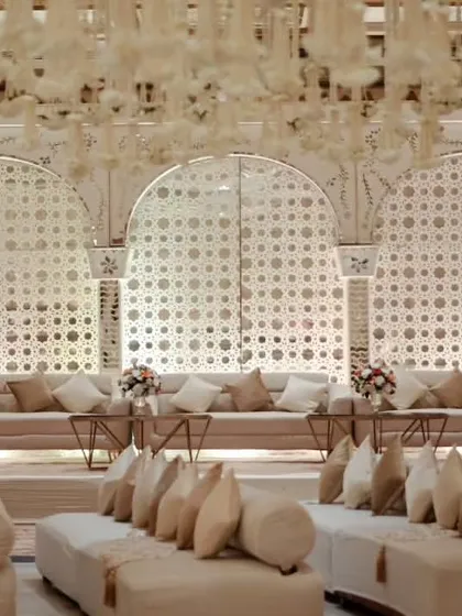 For a Sufi Night, we designed this 'Mastani Mahal' setup. It featured low floor seating with bolsters, intricate jaali backdrops, and a color palette of cream and gold to evoke royal, old-world charm.