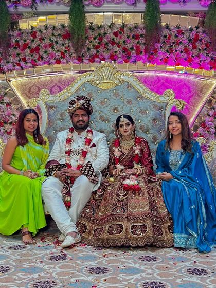 Posing with the happy couple on their wedding day after executing a grand surprise performance for the bride.