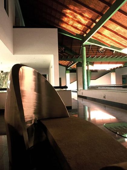 The interior of the LMW Corporate Office in Coimbatore, featuring a custom-designed sculptural bench. Every element is considered, integrating furniture and art into a cohesive architectural vision.