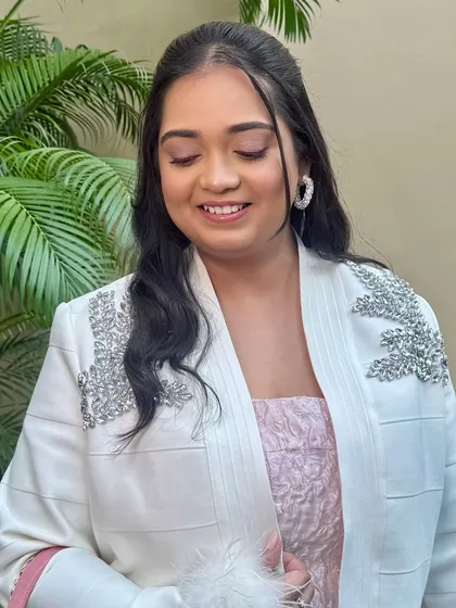 A close-up of the soft pink eyeshadow. The colour is subtle yet adds a beautiful warmth to her overall look.