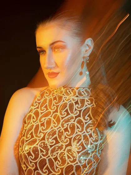 More motion blur and light trails. This shot feels energetic and captures a fleeting moment, almost like a memory.
