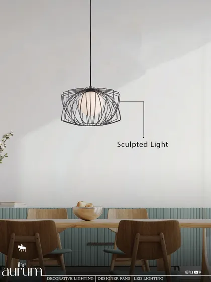 This 'Sculpted Light' pendant features a delicate wireframe that encases a soft, glowing orb. It’s an artistic piece that feels light and airy, perfect for a modern dining room or kitchen.