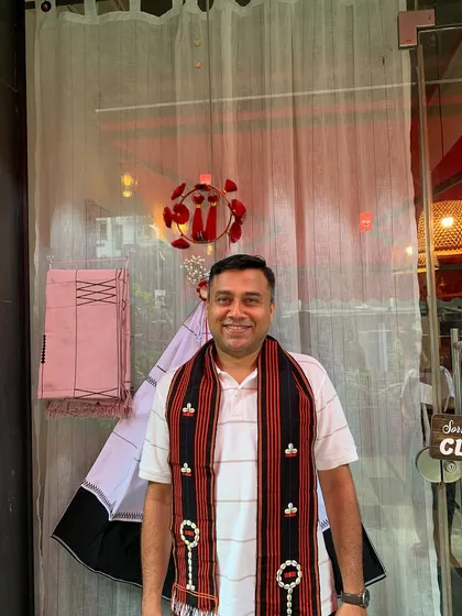 A guest proudly wearing a traditional Naga scarf during our Tuluni festival celebration. We love it when our guests embrace our culture.