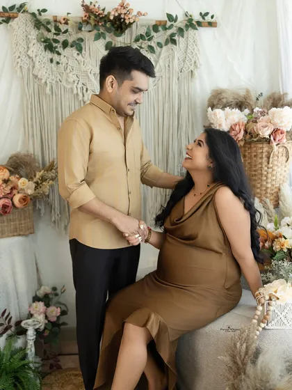 Laughter and love in a candid moment. This couple's portrait captures a genuine interaction, showcasing their happy connection in a relaxed, lifestyle setting.