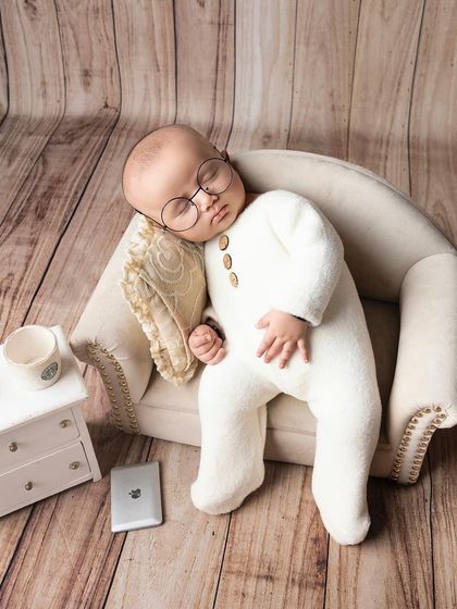 Hard at work in dreamland. This cute setup with tiny glasses and a miniature laptop is a playful take on the modern working world.