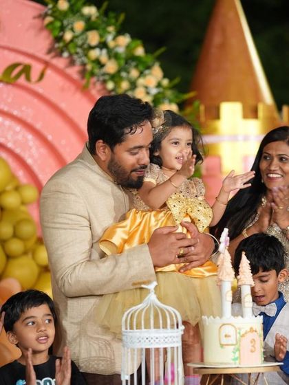 A sweet moment from Soha's party, with her father holding her during the cake-cutting ceremony.