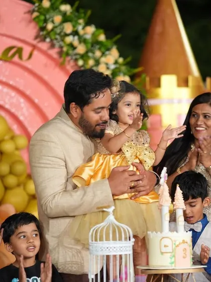 A sweet moment from Soha's party, with her father holding her during the cake-cutting ceremony.