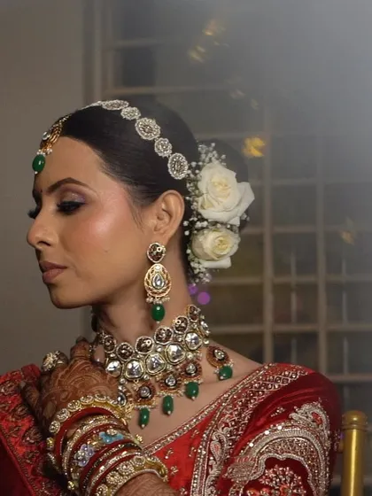 A beautiful profile shot that captures the elegance of the bride's complete look, from her hair to her jewelry.