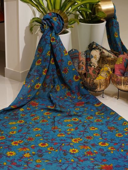 This is a glimpse into my Kalamkari Edition, featuring a wide array of hand-painted dupattas and fabrics from the Indralokam series. Each piece is a unique story, available for you to customize into your dream outfit.