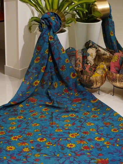 This is a glimpse into my Kalamkari Edition, featuring a wide array of hand-painted dupattas and fabrics from the Indralokam series. Each piece is a unique story, available for you to customize into your dream outfit.