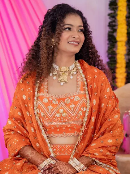 I did my own makeup for my Roka ceremony. I wanted a look that was natural, glowing, and celebrated my curly hair, all while feeling completely myself.
