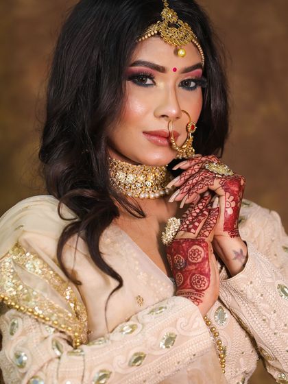 A beautiful bridal portrait. This look features a soft smokey eye, a nude lip, and loose waves for a modern and romantic feel.