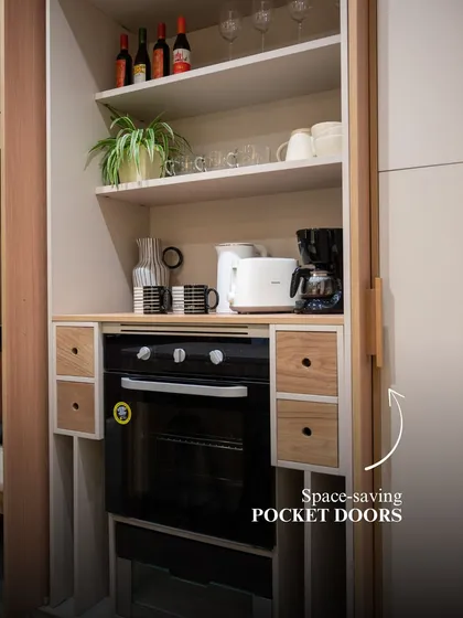 This appliance garage features space-saving pocket doors that slide back into the cabinet. It’s the perfect solution for keeping your toaster and coffee maker accessible but hidden, maintaining a clean countertop.