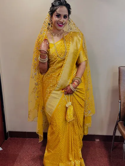 My bride from yesterday, looking radiant in a yellow saree for one of her wedding functions.