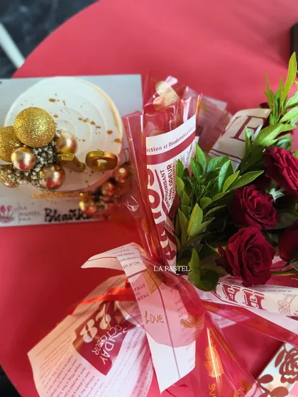 Another angle of the 40th birthday combo, showing the rich red background that makes the white cake and red roses pop.