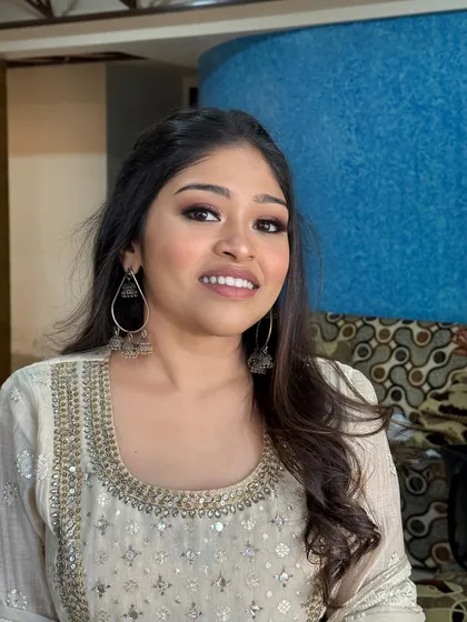 A smiling shot of the client, her minimal makeup looking fresh and beautiful.