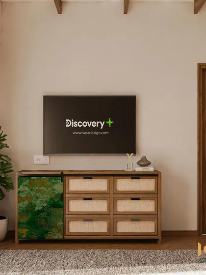 A full view of the custom TV console, showing the blend of natural wood, cane, and the bold green accent piece.