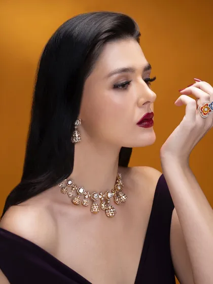A profile shot that highlights the intricate details of the jewellery and the model's elegant pose. My goal in editorial styling is to create a complete narrative, where every element works together.