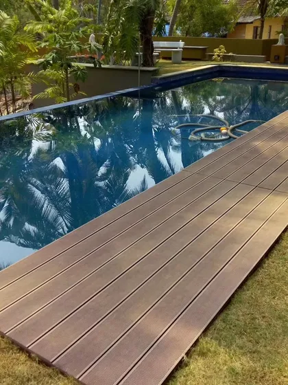 We extend living spaces to the water's edge. This project features our all-weather WPC decking installed alongside a swimming pool, providing a safe, slip-resistant, and beautiful surface that evokes a resort-like feel.