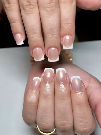 A classic French manicure with a twist of chrome. The subtle shimmer of the base gives this timeless look a modern, updated feel.