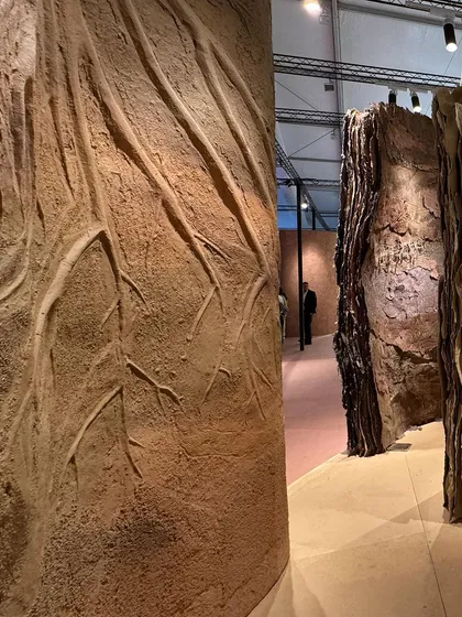 A powerful detail of the debossed roots on a 'Soil' sculpture. The texture is deep and dramatic, conveying the strength and life force of the earth.