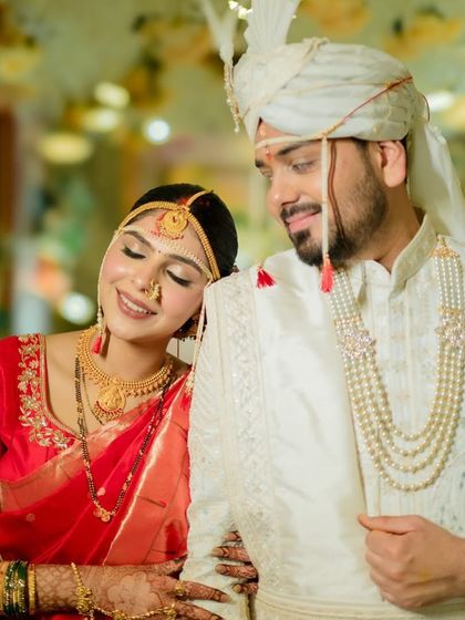 A sweet, romantic pose. The bride's soft makeup and glowing skin look perfect next to the groom's classic attire.