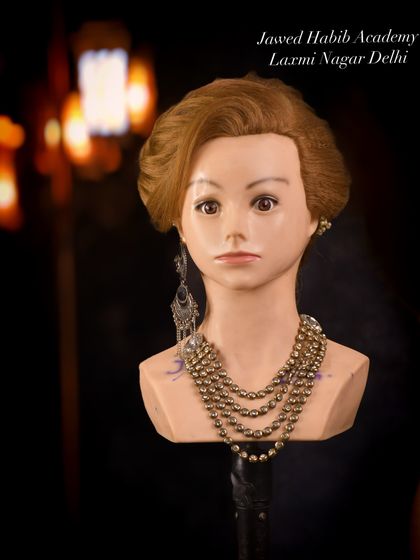 A short, retro-inspired hairstyle demonstrating our students' versatility in working with different hair lengths and historical styles.