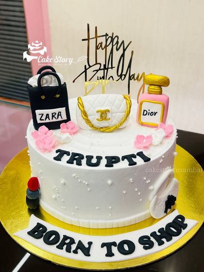 Another angle of the "Born to Shop" cake, showing the lipstick and other fun details.