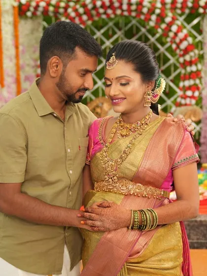 A loving moment captured at the baby shower. Malini's traditional jewellery perfectly suits the joyous and sacred occasion.