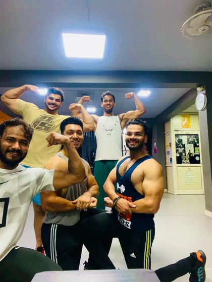 All smiles and flexes after a great session. We believe in working hard and having fun together. This is what our Fit Fam community is all about.