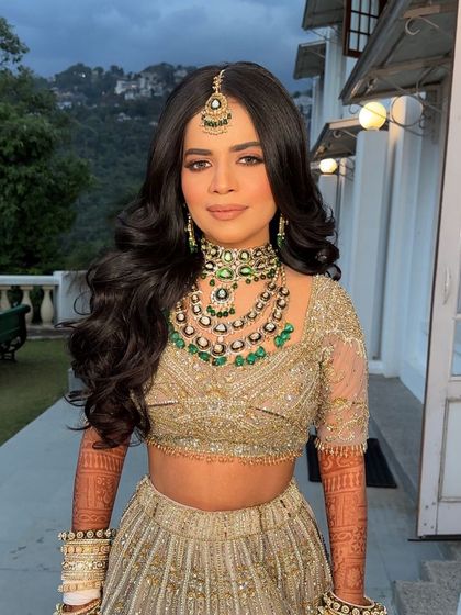 The bride looking radiant, her open hairstyle a perfect choice for a modern bride who wants a natural and free-spirited look.