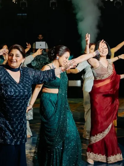 The ladies of the family united in a graceful dance move. We create beautiful formations for large group performances.