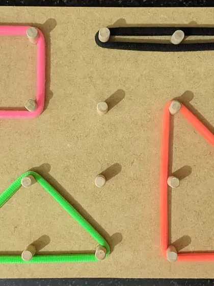 This handmade geometric board invites little hands to explore shapes and create their own patterns. Stretching the elastic bands around the pegs is a wonderful activity for developing fine motor skills, hand-eye coordination, and the pincer grasp needed for writing. It’s a simple tool with endless possibilities for learning.