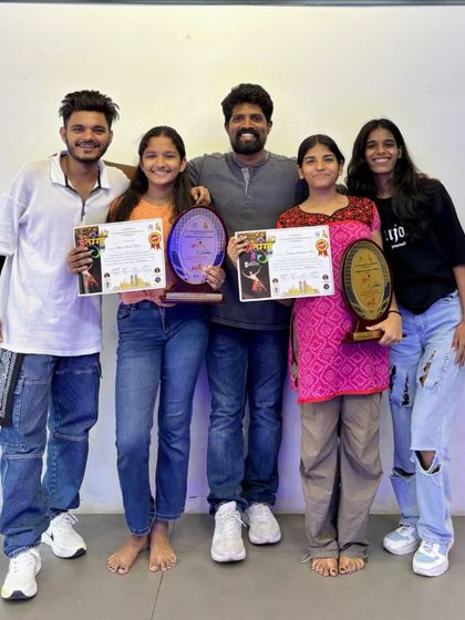 Posing with some of our competition winners and their trophies. The whole team, including instructors, celebrates these big wins together.