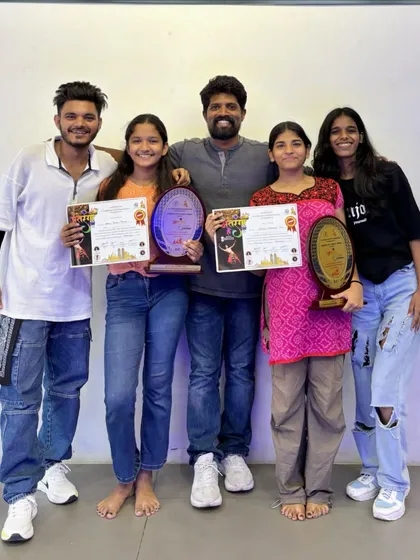 Posing with some of our competition winners and their trophies. The whole team, including instructors, celebrates these big wins together.