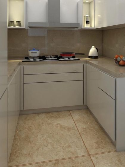 A full view of the U-shaped compact kitchen. The design maximizes storage and counter space, proving that even small kitchens can be highly functional and visually appealing.