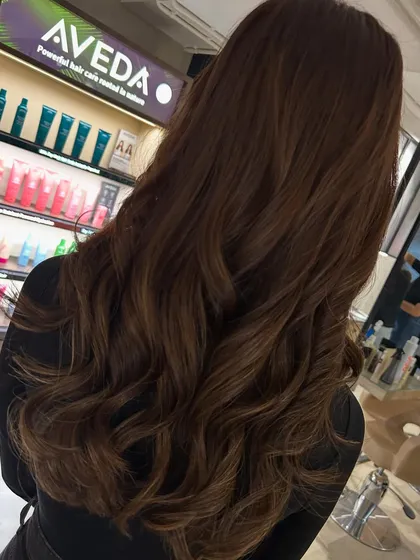 This client was ready for a big change, so we went from long to mid-length hair. I added fringe bangs and a color refresh to complete her stylish new look.