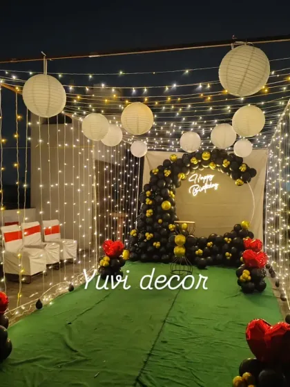 Another perspective of the outdoor canopy setup, showing the full structure draped in fairy lights. This creates a stunning entrance for guests at an evening party.