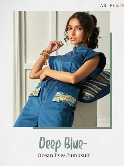 The Deep Blue Ocean Eyes Jumpsuit. This piece combines a stylish, modern silhouette with art-infused pockets, offering a look that is both comfortable and fashion-forward.