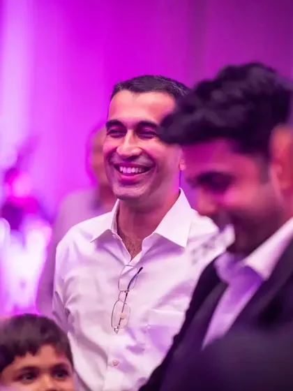 A wide, genuine smile from an audience member. Seeing the crowd this happy is the greatest reward for any performer.
