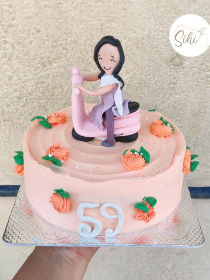 Why should boys have all the fun? This cute cake features a girl riding a pink scooter, surrounded by buttercream flowers, for a fun and empowering celebration.