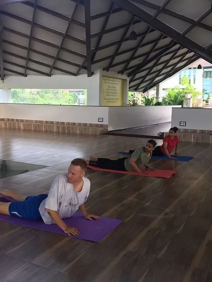 Our instructors ensure that each guest is comfortable and practicing safely. Here, guests hold Bhujangasana to build strength and flexibility in the back.